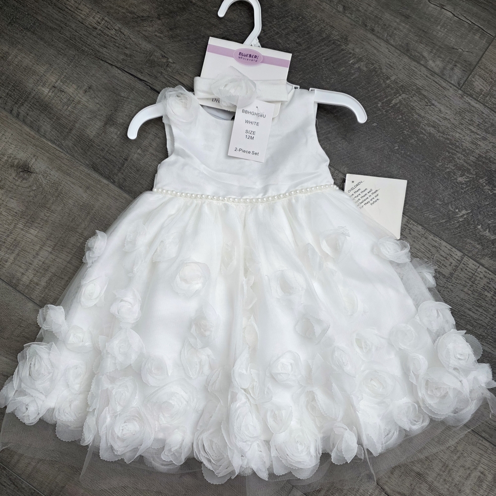 Sold Elegant White Kids Dress with Floral Accents